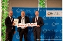 Während der Auszeichnung v.l.n.r. Tom Rückborn von Windenergiecluster M-V, Stralsunds Klimaschutzbeauftragter Stephan Latzko und Bundesminister Volker Wissing